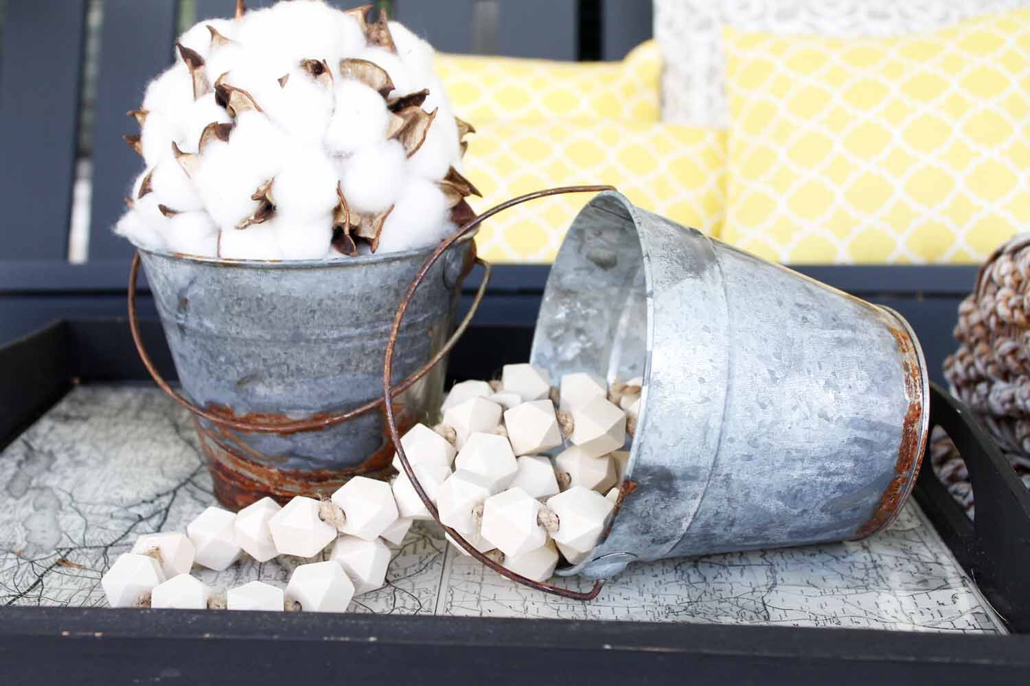 Metal buckets looks so rustic and perfect for the farmhouse look