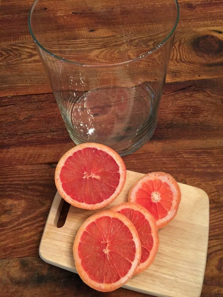 Red grapefruit sliced for a floral arrangement