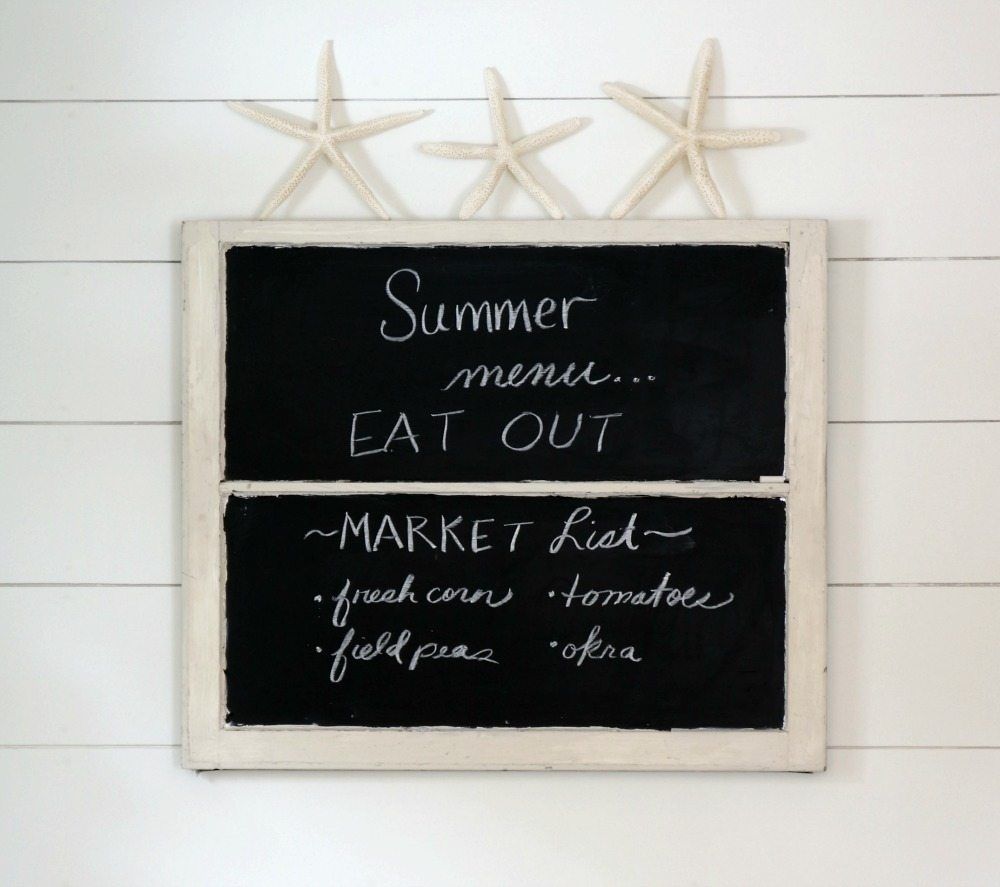 Starfish propped on an old window chalkboard perfect for summer in the farmhouse kitchen