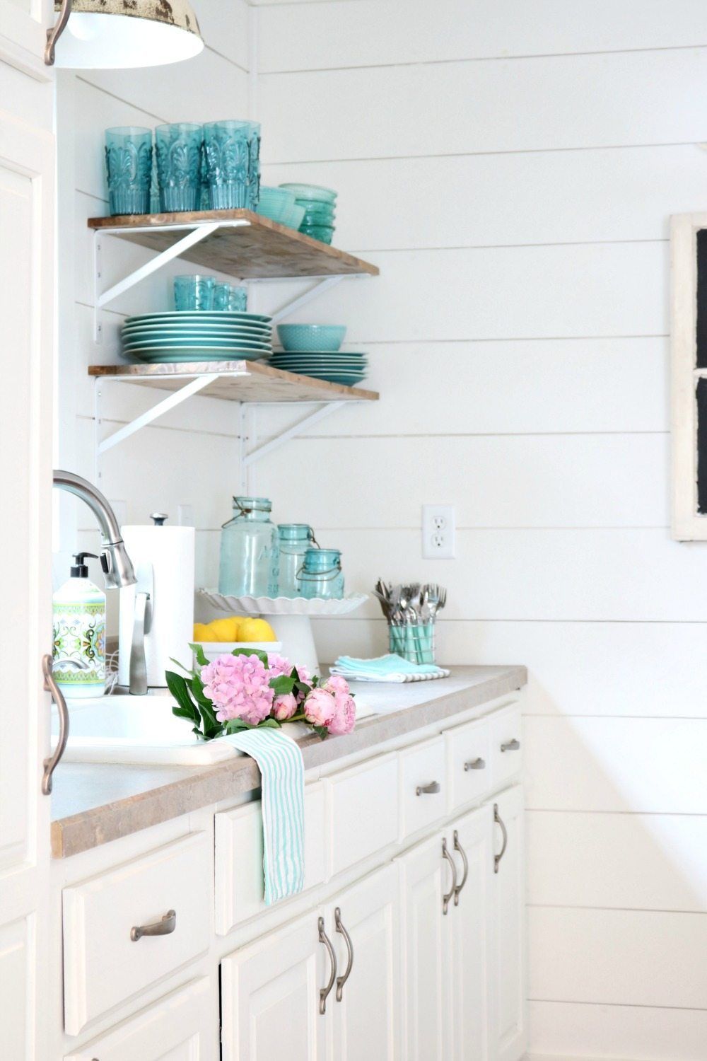 White shiplap and open shelves perfect for the farmhouse cottage look