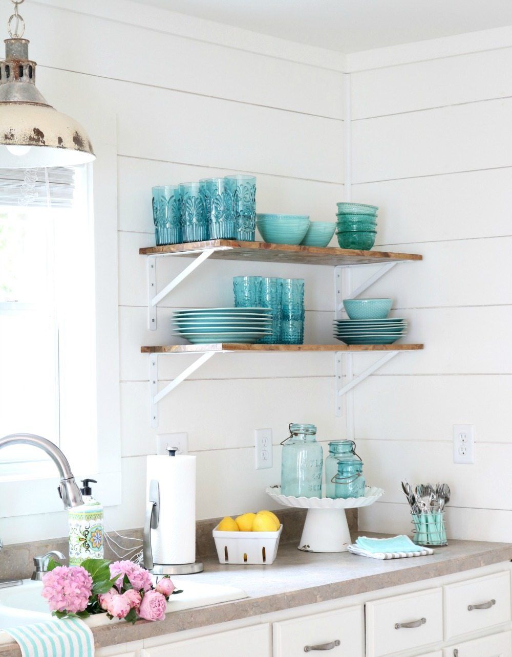 Alabaster walls with shiplap and open shelves are perfect for aqua turquoise dishes at Refresh Restyle