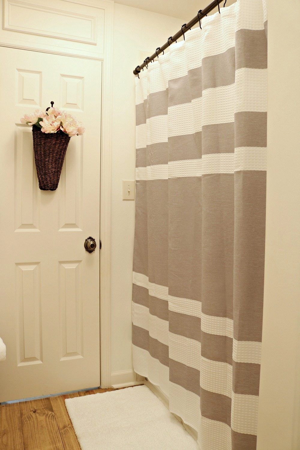 Gray and white waffle striped shower curtain perfect for a neutral farmhouse look
