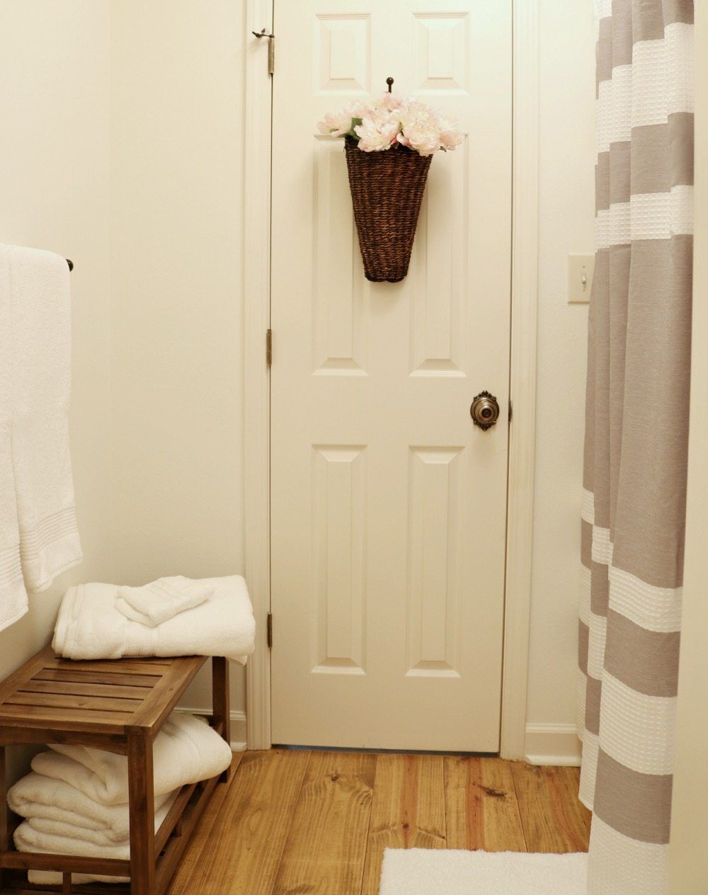 Pine floors in a simple farmhouse bathroom