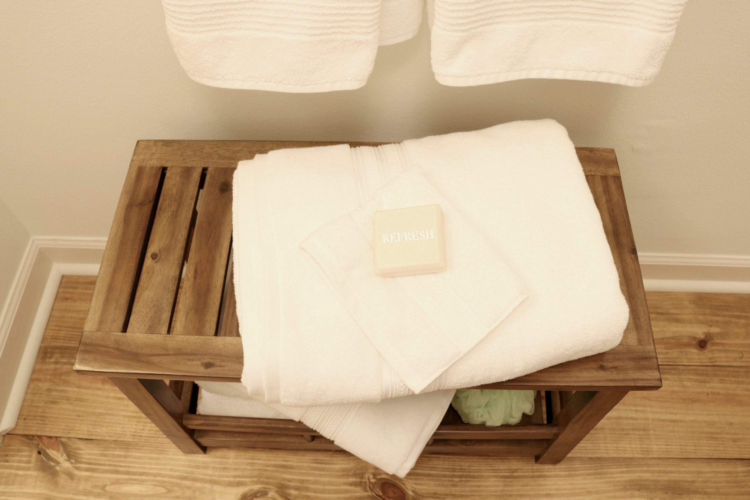 Plenty of white towel and sweet smelling soap for the minimal farmhouse bath