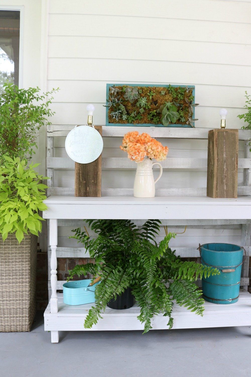 Pallet potting table with vertical succulent art at Refresh Restyle