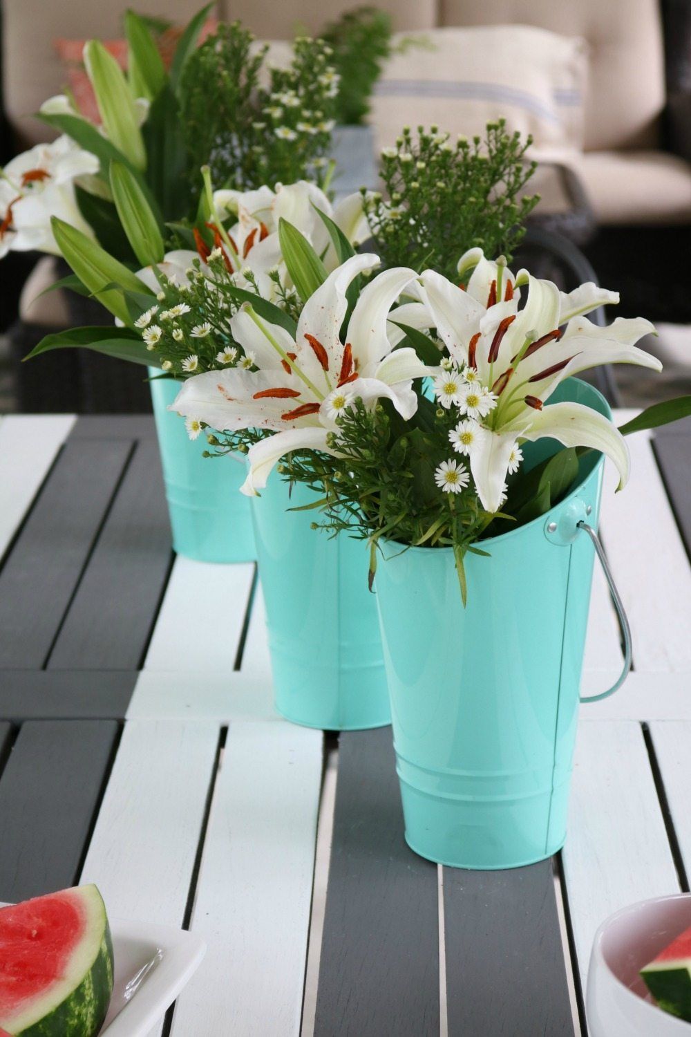 Target Dollar spot buckets are perfect for vases on the porch at Refresh Restyle